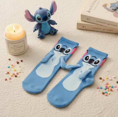 Pair of blue Stitch socks holding hands with built-in magnets